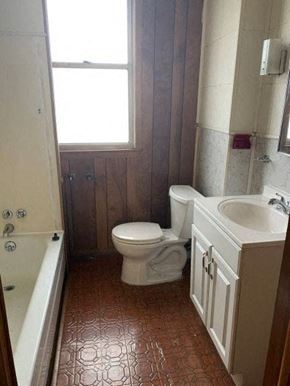 West Homestead apartment for rent - A small bathroom with a toilet, sink and tub.