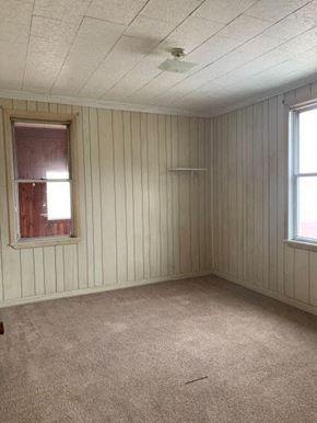 West Homestead apartment for rent - A room with a window and a ceiling fan.