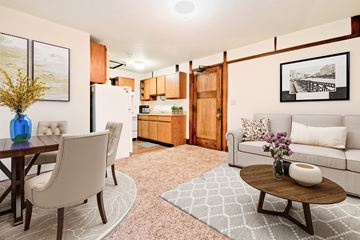 Grand Forks apartment for rent - a living room and kitchen with a table and chairs
