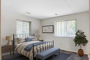 Norristown apartment for rent - a bedroom with a bed and two windows