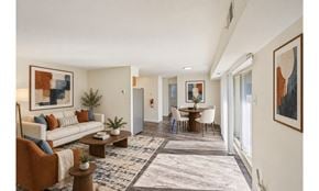 Levittown apartment for rent - A living room with a white couch, a coffee table, and a rug.