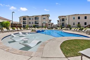 San Marcos apartment for rent - Apartments in San Marcos, TX for Rent - Sadler House Apartments - Pool with a Sundeck, Lounge Chairs, Tables, and a Maintained Landscape