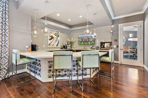 San Marcos apartment for rent - a kitchen with a bar and a dining area with chairs