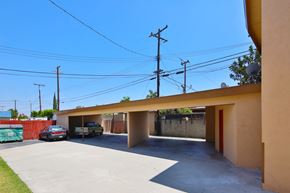 Downey apartment for rent - A car is parked in a garage.
