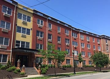 Montclair apartment for rent - a large brick building with a street in front of it
