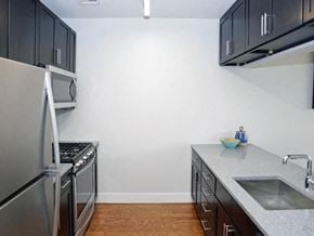 Montclair apartment for rent - a kitchen with stainless steel appliances and a sink