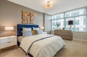 Arlington apartment for rent - a bedroom with a bed and a window