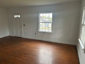 Talladega apartment for rent - A room with a wooden floor and a window.