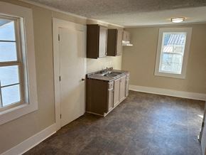 Talladega house for rent - an empty kitchen with a sink and a window