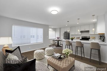 San Francisco apartment for rent - A modern living room with a black couch and a coffee table.