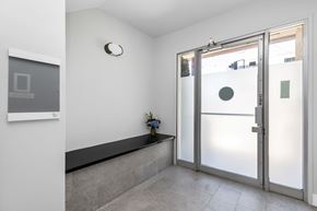 San Francisco apartment for rent - A glass door with a handle and a small plant on the ledge.