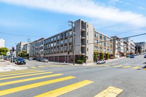 San Francisco apartment for rent - A street view with a crosswalk and cars on the road.
