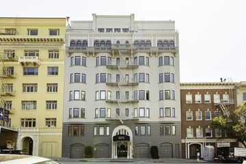 San Francisco apartment for rent - A row of buildings with the middle one being white.