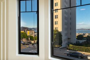 San Francisco apartment for rent - A black car is parked in front of a building.