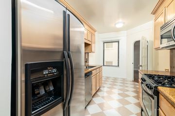 San Francisco apartment for rent - A modern kitchen with a checkered floor and a refrigerator on the left.