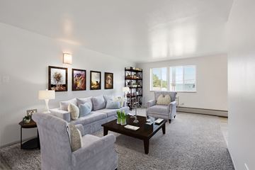 Denver apartment for rent - a living room with couches and chairs and a coffee table