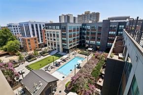 Alexandria apartment for rent - A view of a pool and apartment complex from above.