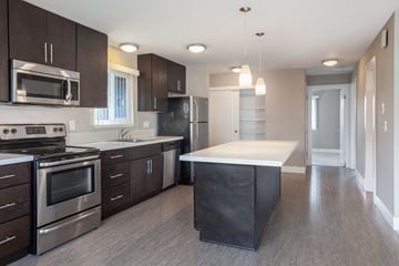 Los Gatos apartment for rent - a kitchen with stainless steel appliances and a white counter top