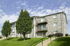 Omaha apartment for rent - a stone building with a tree in front of it