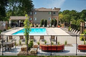 Omaha apartment for rent - our apartments have a large pool and a patio with chairs