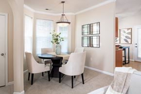 Omaha apartment for rent - a dining room with a table and chairs