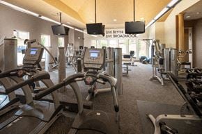 Omaha apartment for rent - A gym with treadmills, exercise bikes and other equipment.