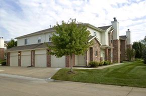 Omaha apartment for rent - a house with a tree in the front of it