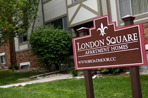 Omaha apartment for rent - a sign for the square apartment homes