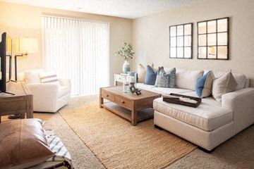 Omaha apartment for rent - a living room with a couch and a chair