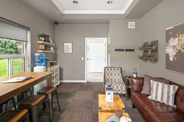 Omaha apartment for rent - A living room with a brown couch and a coffee table.