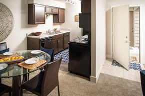 Omaha apartment for rent - a kitchen and dining room with a table and chairs