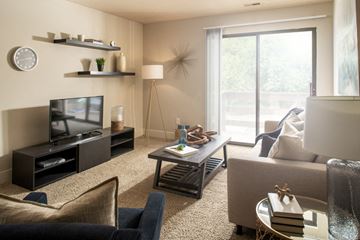 Omaha apartment for rent - a living room with a couch and a table and a television