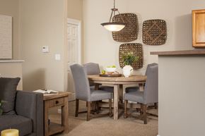 Omaha apartment for rent - a dining room with a wooden table and chairs