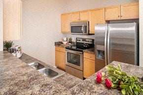Omaha apartment for rent - a kitchen with stainless steel appliances and granite counter tops
