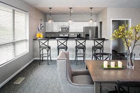 Omaha apartment for rent - a kitchen and dining room with a table and chairs