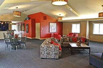 Bellevue apartment for rent - A living room with a grey carpet and a red wall.