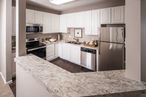 Lincoln apartment for rent - a kitchen with stainless steel appliances and granite counter tops