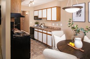 Sioux City apartment for rent - a kitchen and dining room with a table and chairs