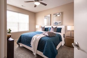West Des Moines apartment for rent - a bedroom with a bed and a ceiling fan
