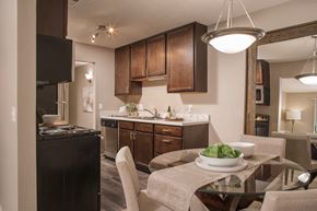Windsor Heights apartment for rent - A modern kitchen with a dining table set for two.