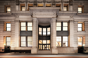 New York apartment for rent - the facade of the broad exchange at night