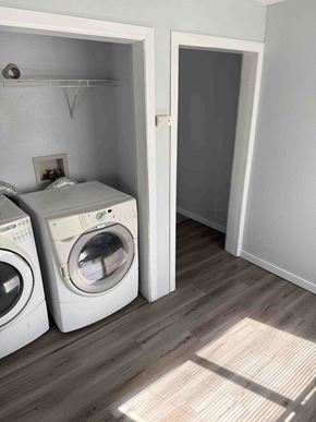 Fargo apartment for rent - Two white front load washing machines in a laundry room.