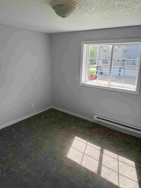 Fargo apartment for rent - A room with a window and a wall painted in grey.