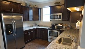 Albany apartment for rent - a kitchen with stainless steel appliances and granite counter tops