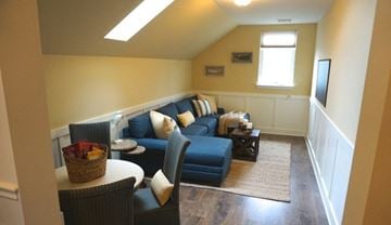 Albany apartment for rent - a living room with a blue couch and a table