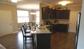 Albany apartment for rent - A kitchen with a table and chairs in front of it.