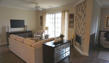 Albany apartment for rent - A living room with a white couch and a television.