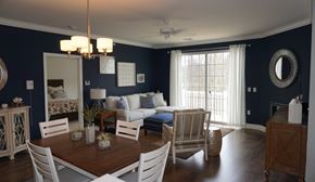 Albany apartment for rent - A dining room with a wooden table and white chairs.