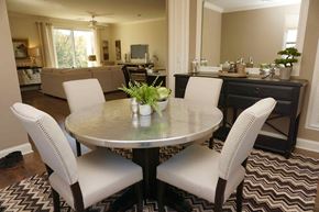 Troy apartment for rent - a dining room with white chairs and a table