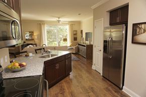 Troy apartment for rent - a kitchen with stainless steel appliances and granite counter tops